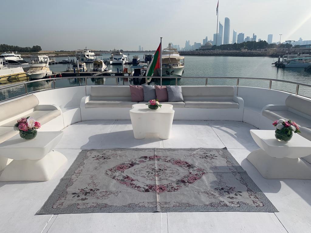 Custom celebration cake served on a luxury yacht charter Abu Dhabi